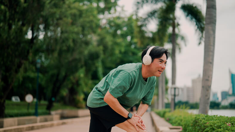 man with headphones outside